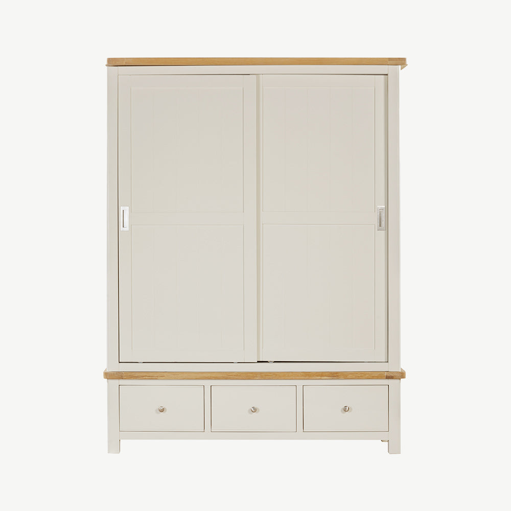 Painted off-white 3 drawer wardrobe, natural wood trim and sleek, silver draw and door handles
