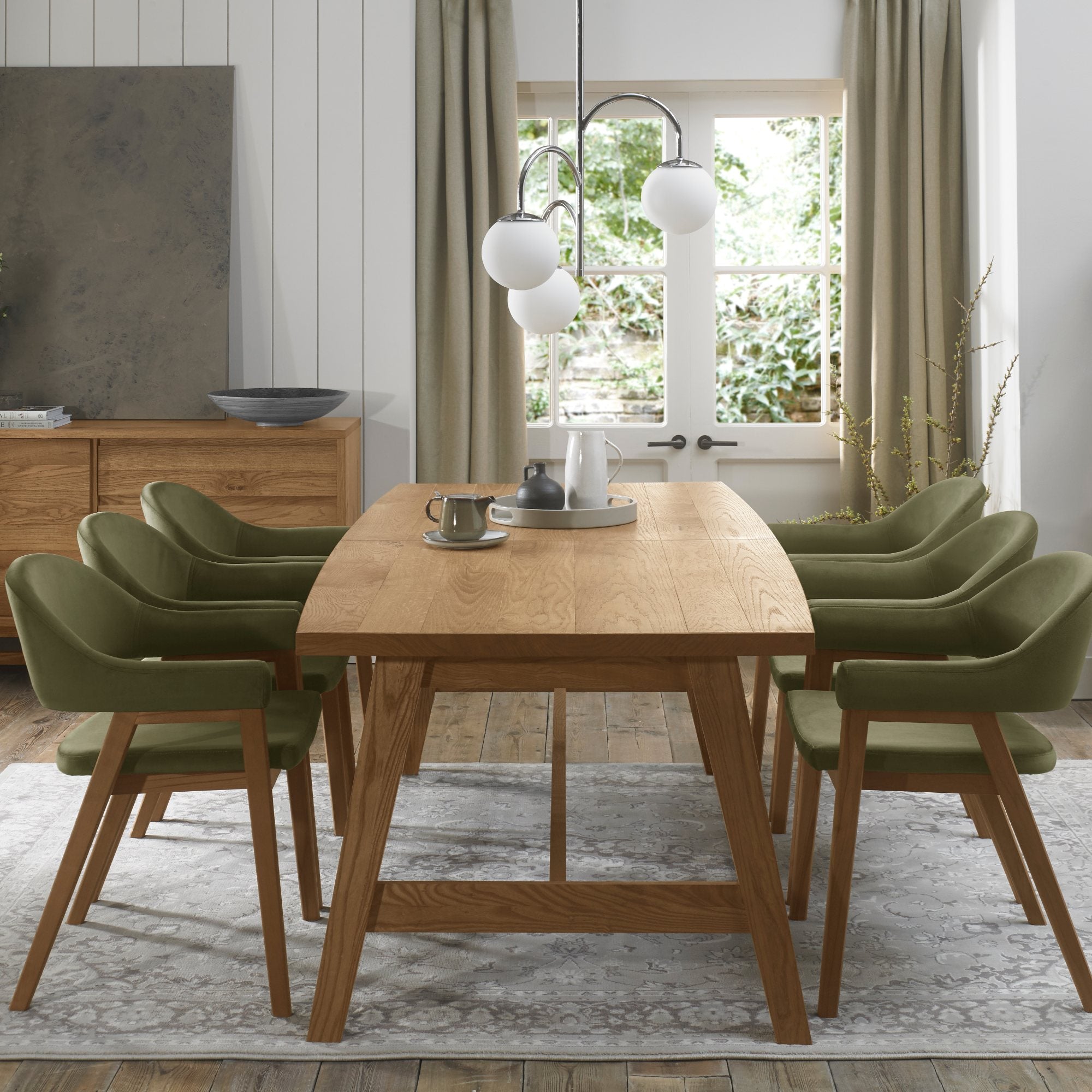 Rustic oak extending dining table with laminated oak tabletops and solid ash legs all in natural finish
