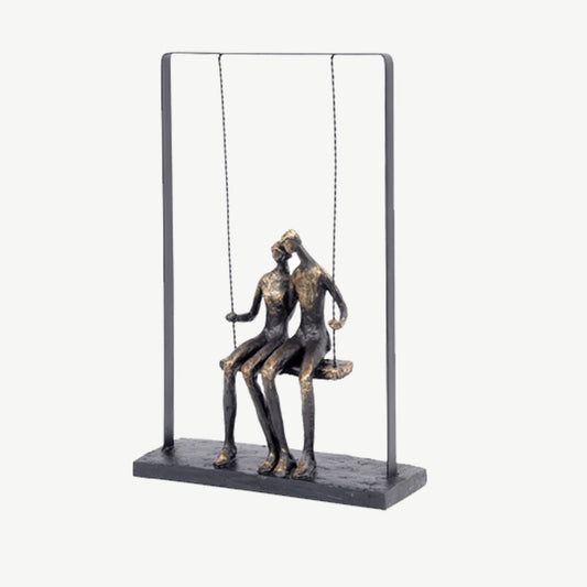 Couple sitting on Swing Sculpture