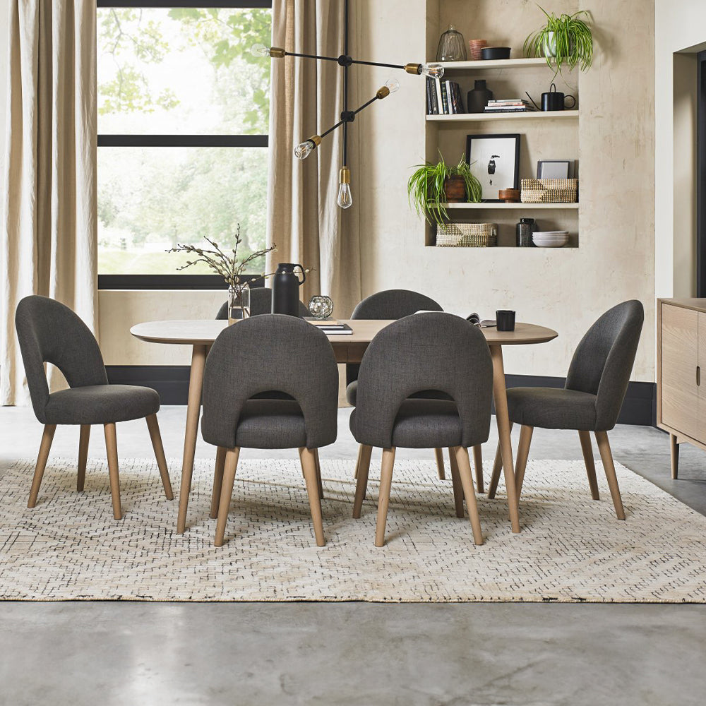 Oak veneer extending dining table with solid beech legs in light oak finish