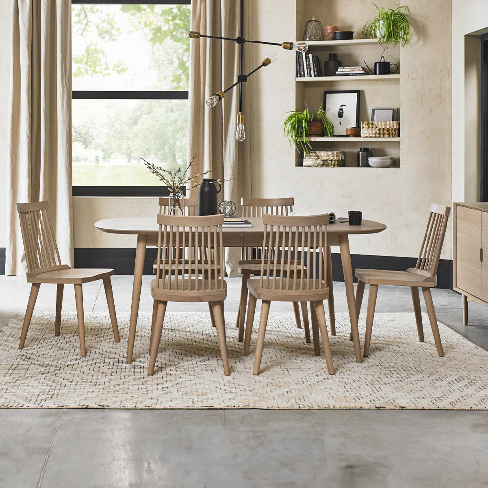 Oak veneer extending dining table with solid beech legs in light oak finish