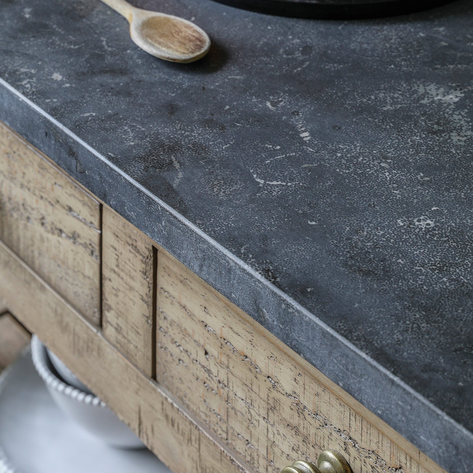 Pine kitchen island in natural finish with dark marble top