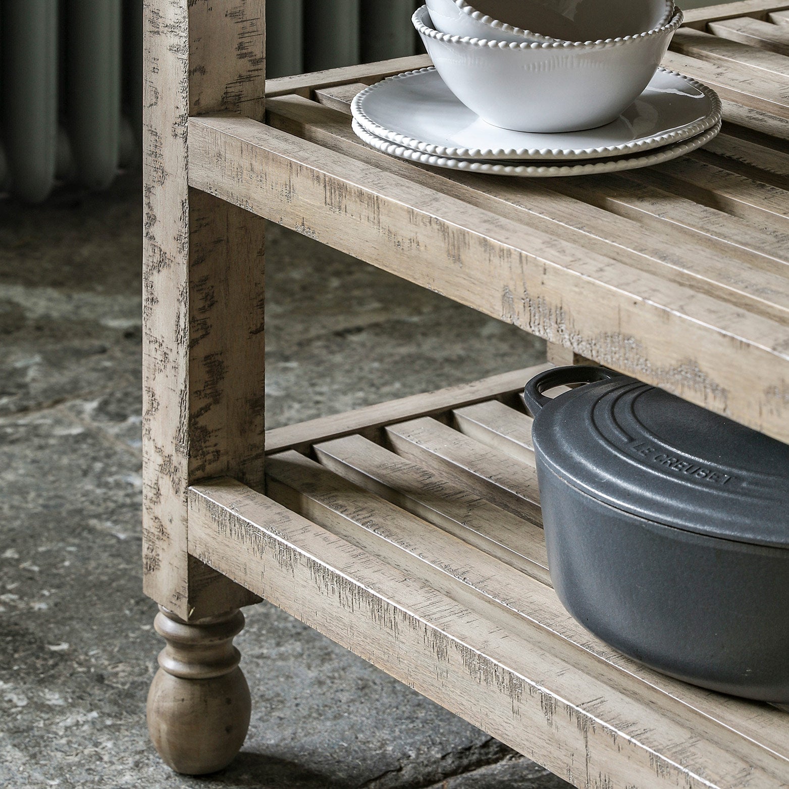 Pine kitchen island in natural finish with dark marble top