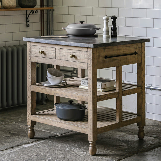 Pine kitchen island in natural finish with dark marble top