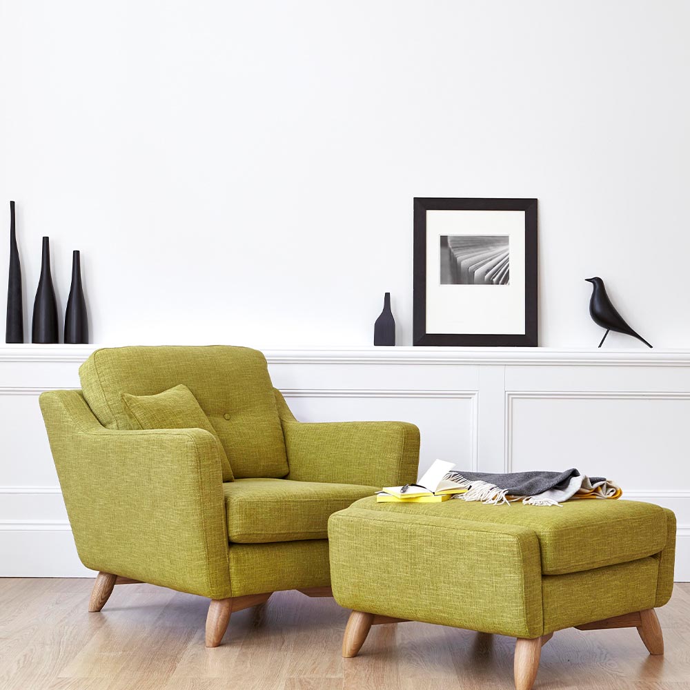 Ercol Cosenza green fabric armchair with solid oak legs