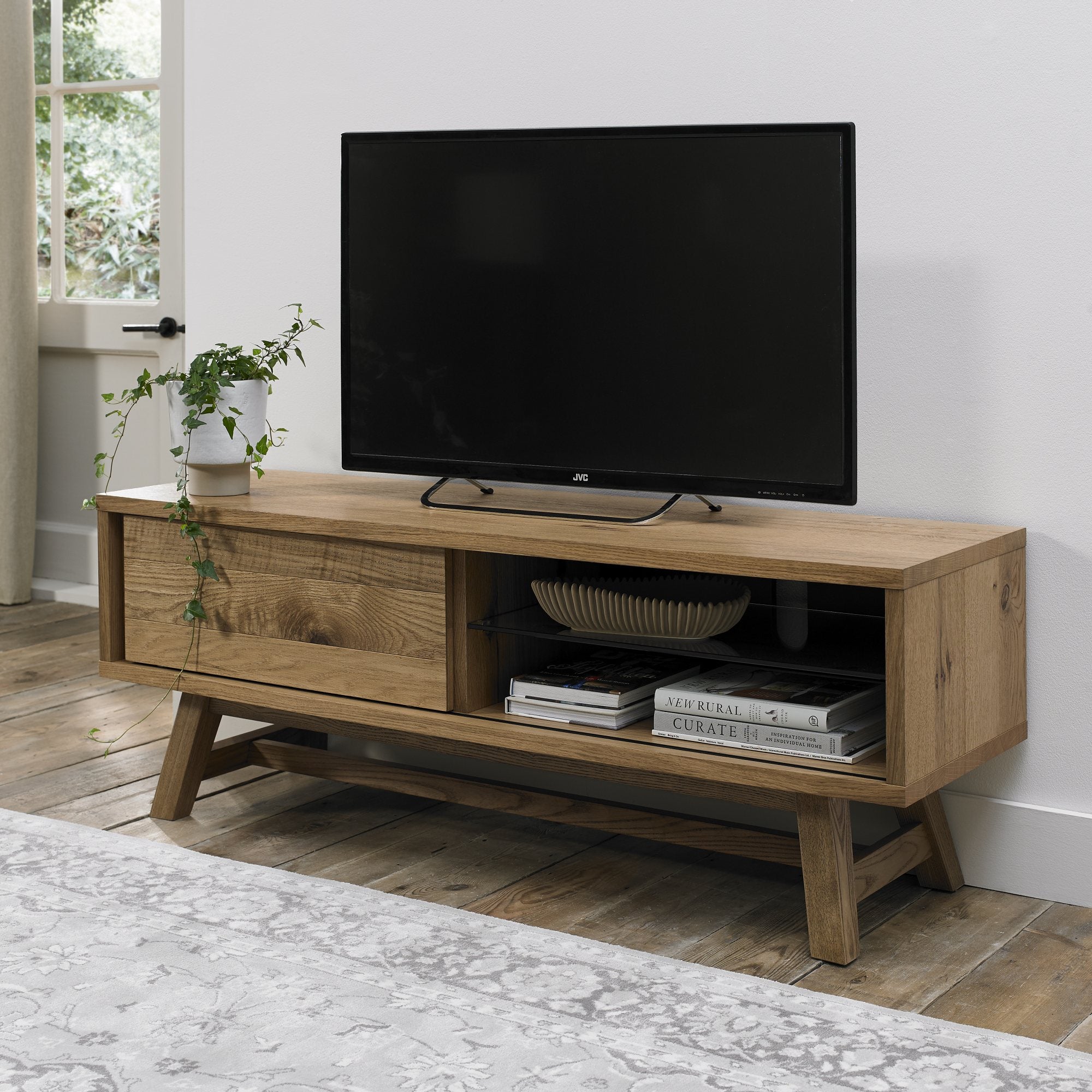 Rustic oak entertainment unit with laminated oak top and solid ash legs all in natural finish
