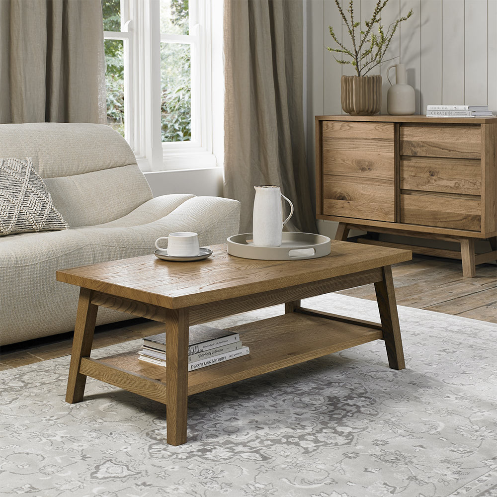 Rustic oak coffee table with laminated oak tabletops and solid ash legs all in natural finish