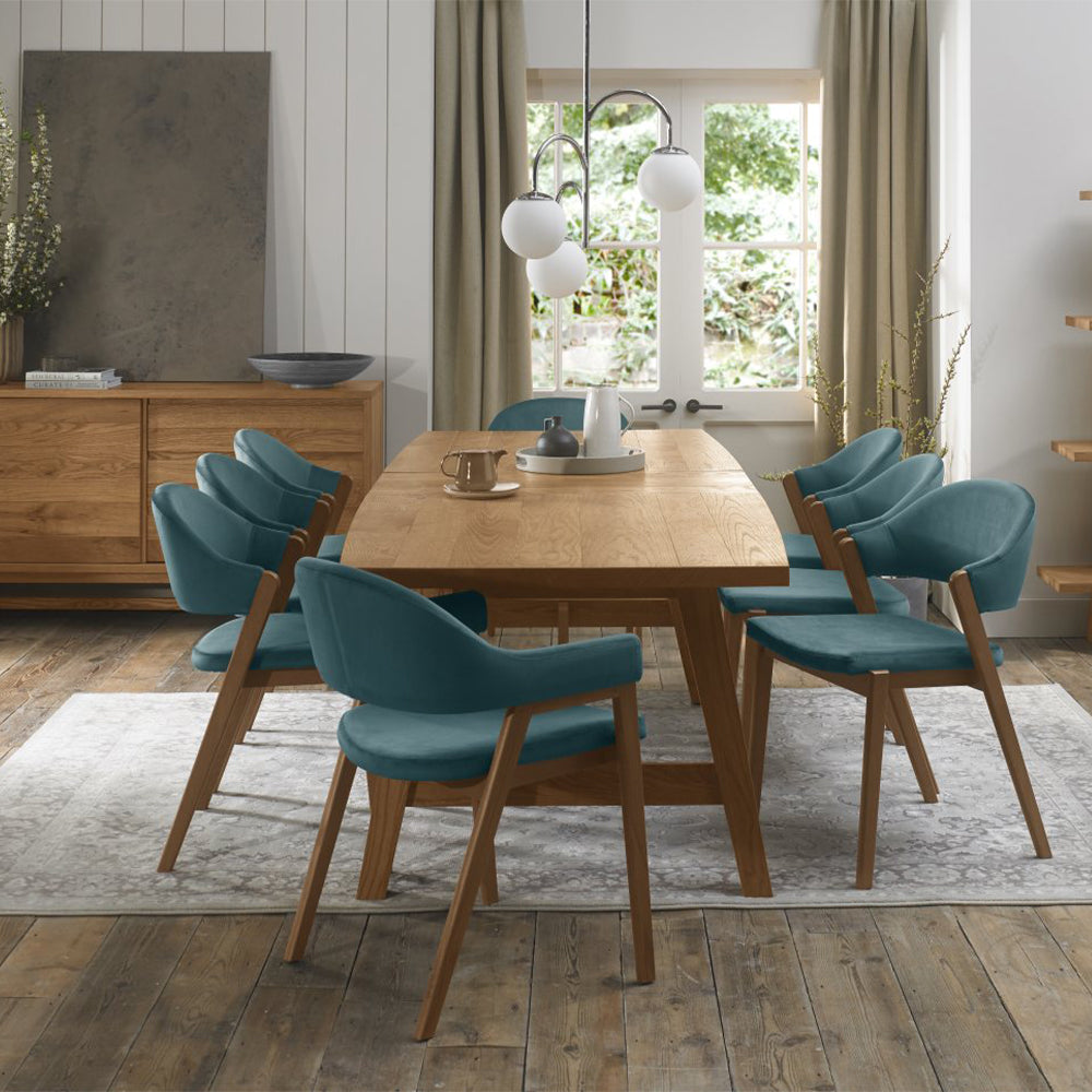 Rustic oak extending dining table with laminated oak tabletops and solid ash legs all in natural finish
