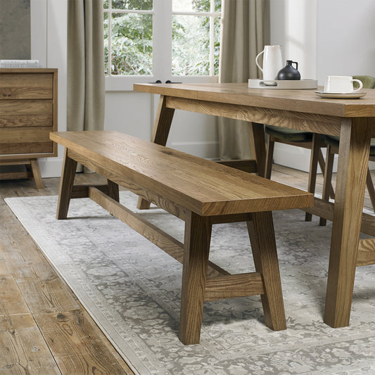 Rustic oak large bench with laminated oak top and solid ash legs all in natural finish
