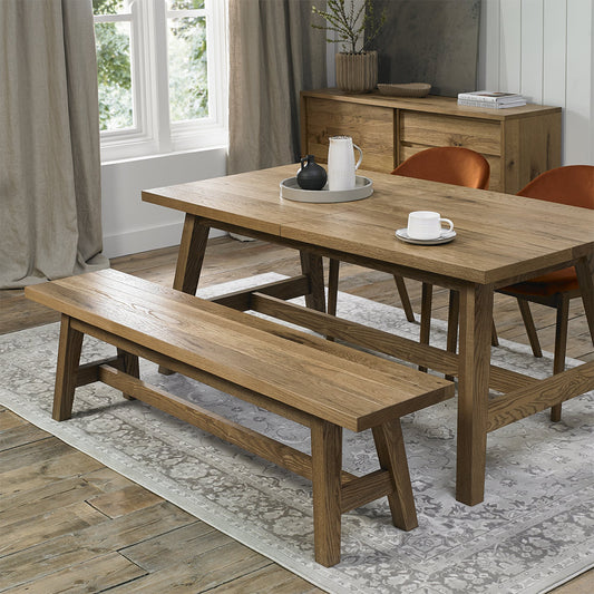 Rustic oak small bench with laminated oak top and solid ash legs all in natural finish
