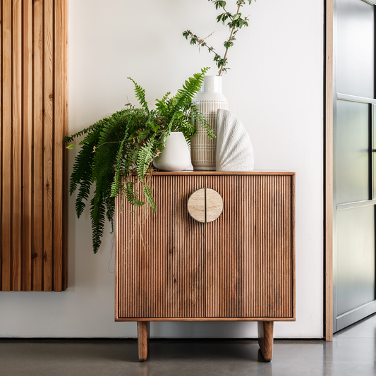 Fluted mango wood highboard with inset handles and travertine stone top