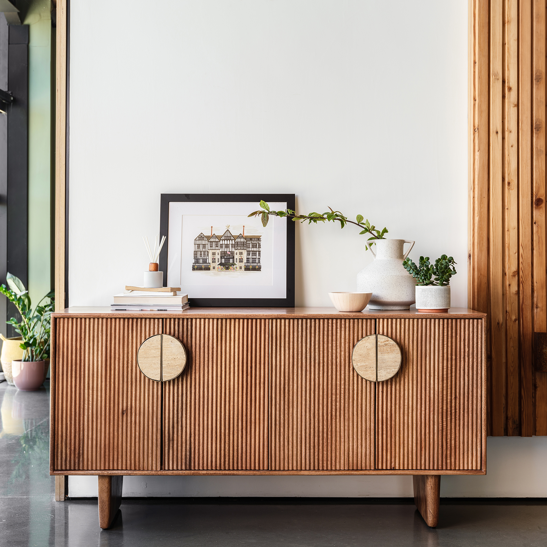 Fluted mango wood wide sideboard with inset handles and travertine stone top
