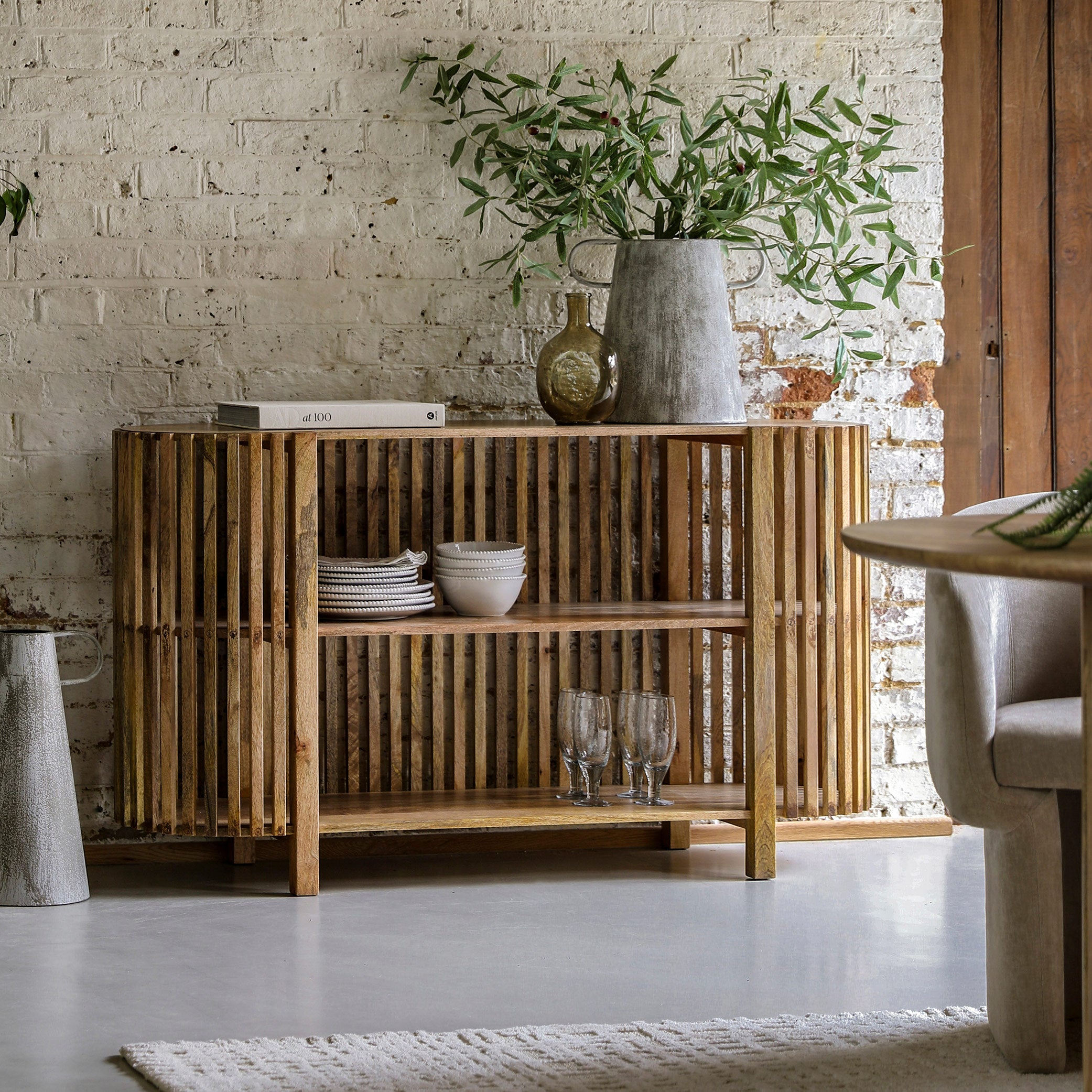 Slatted wooden console table in natural finish with two storage shelves