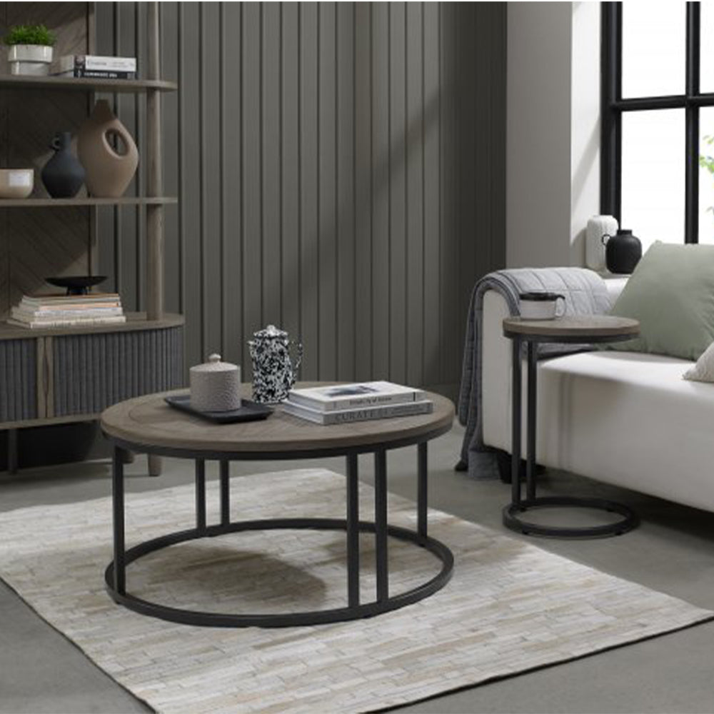 Wooden coffee table with saw-cut ash chevron pattern in silver grey finish and black powder coated metal base