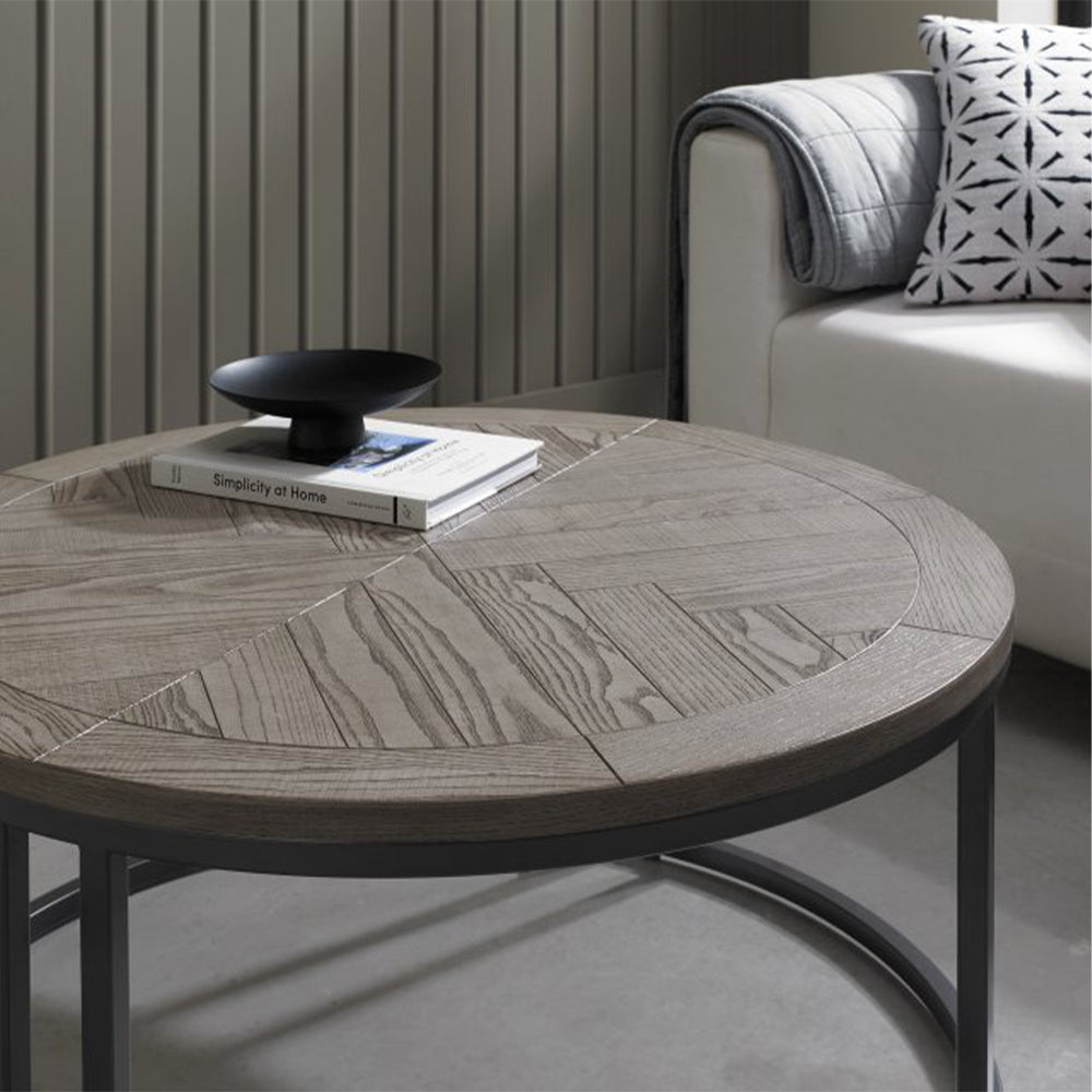 Wooden coffee table nest with saw-cut ash chevron pattern in silver grey finish and black powder coated metal base