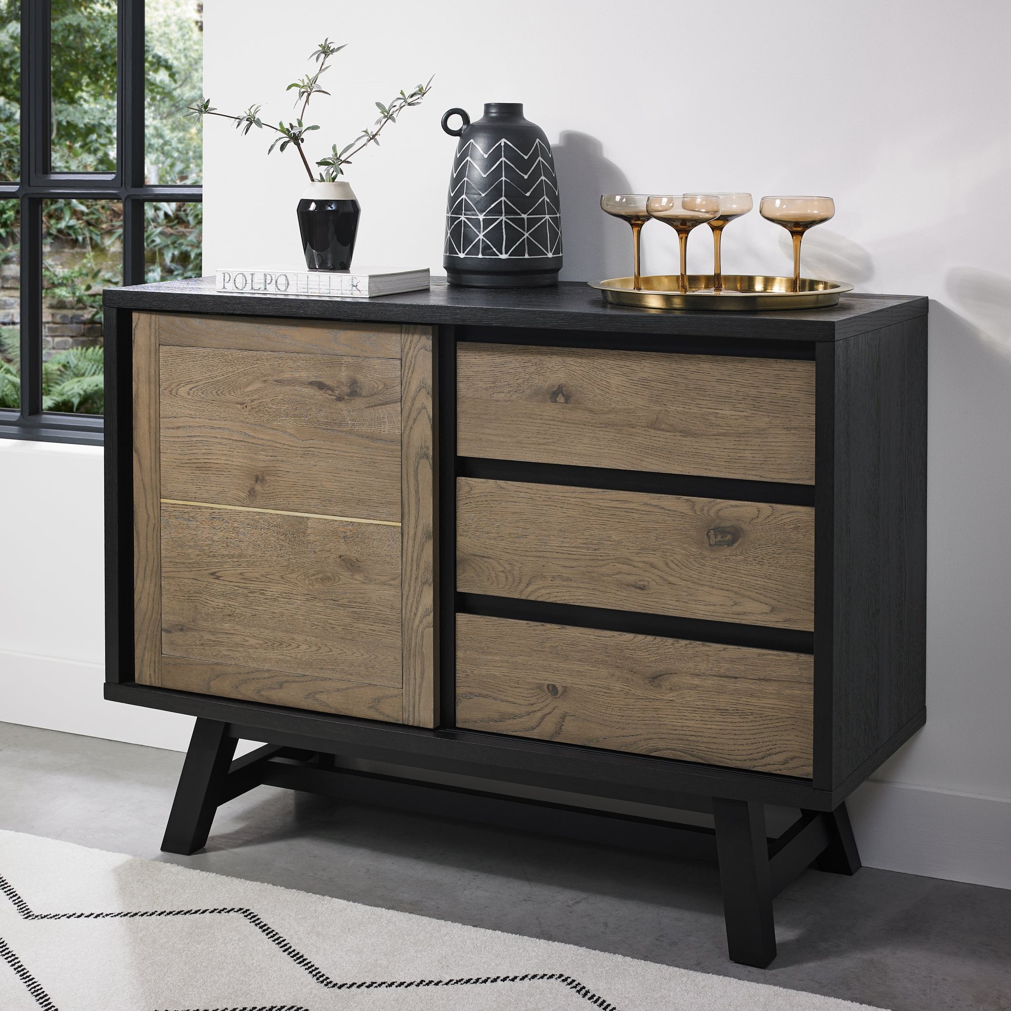 Oak veneer narrow sideboard with black peppercorn base
