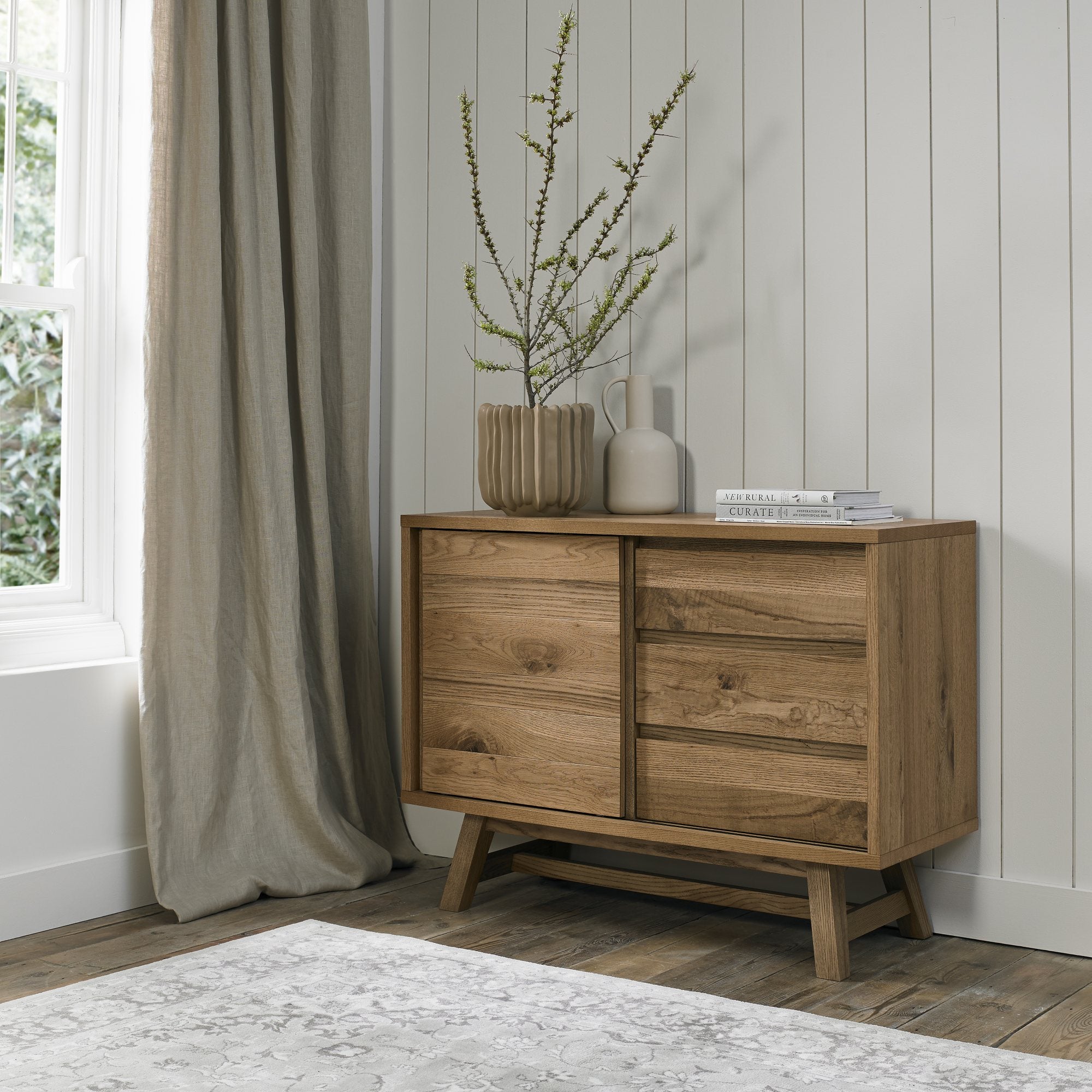 Rustic oak narrow sideboard with laminated oak top and solid ash legs all in natural finish
