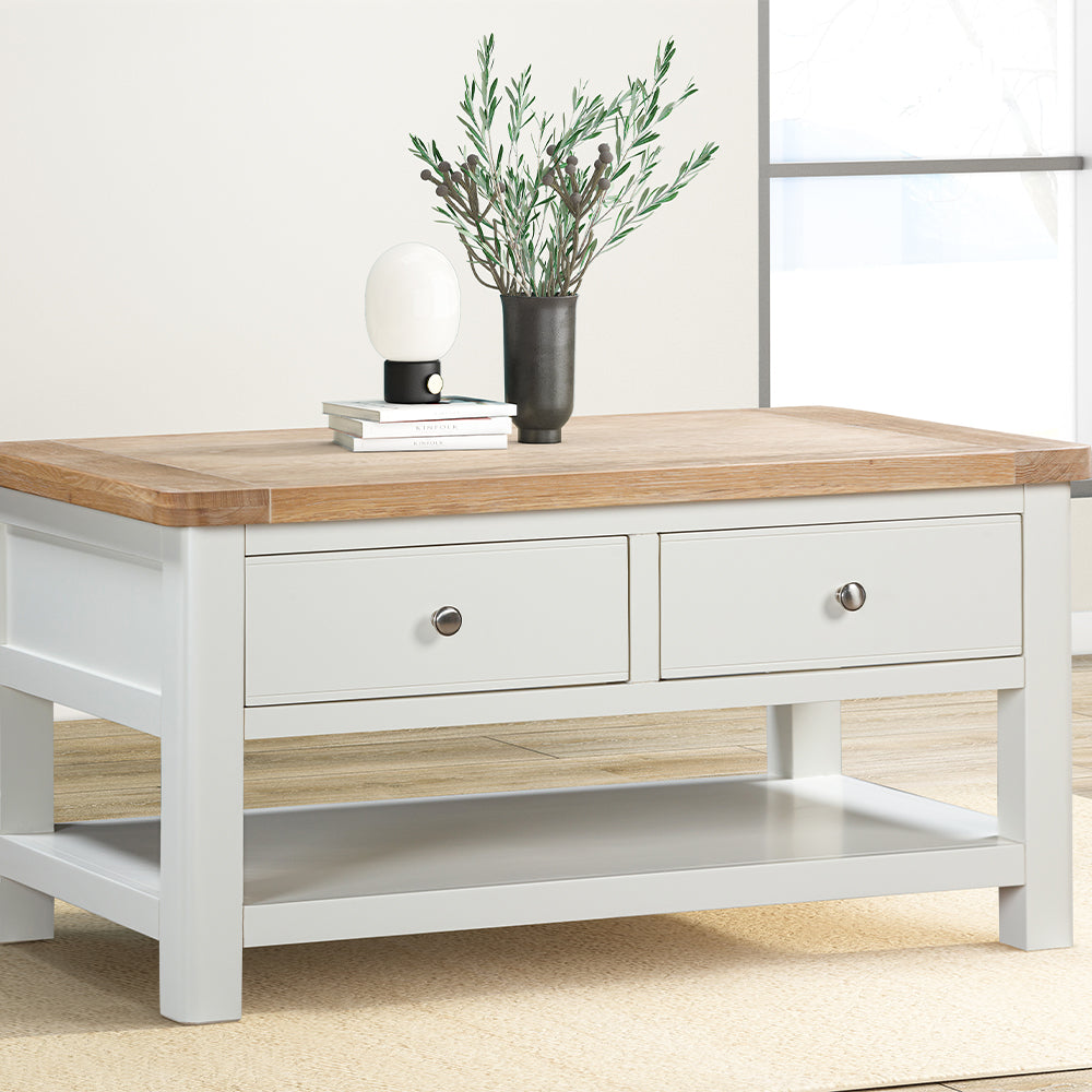 Painted off-white coffee table with natural wood top with two spacious drawers