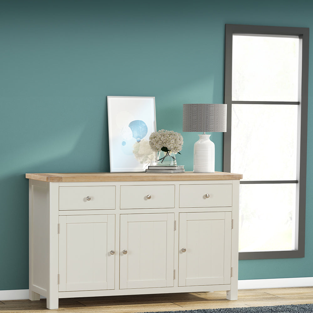 Painted off-white 3 door sideboard with natural wood top, three spacious drawers and three cupboards
