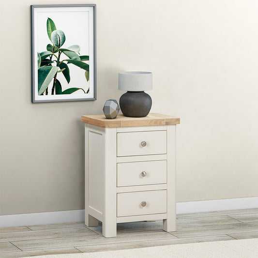 Painted off-white 3 drawer bedside cabinet with natural wood top and three drawers
