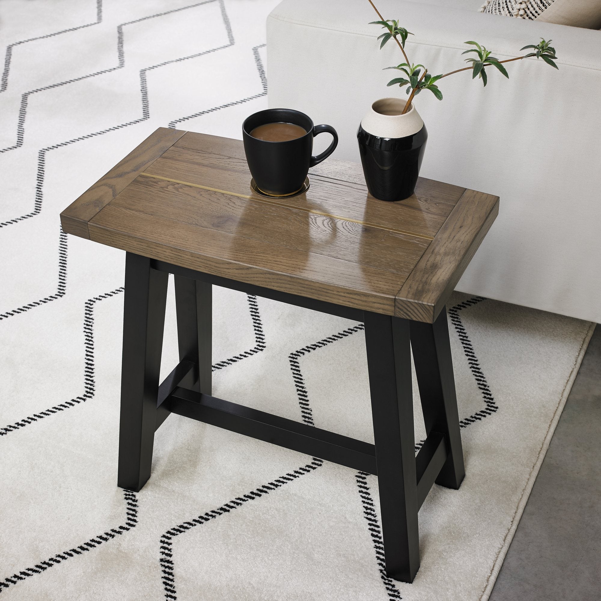 Oak veneer side table with black peppercorn solid ash legs