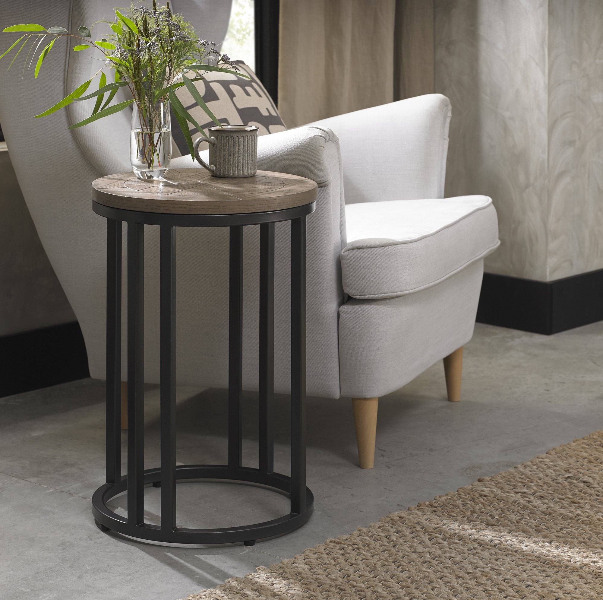 Brown ash veneer side table with marquetry top and black powder coated metal base