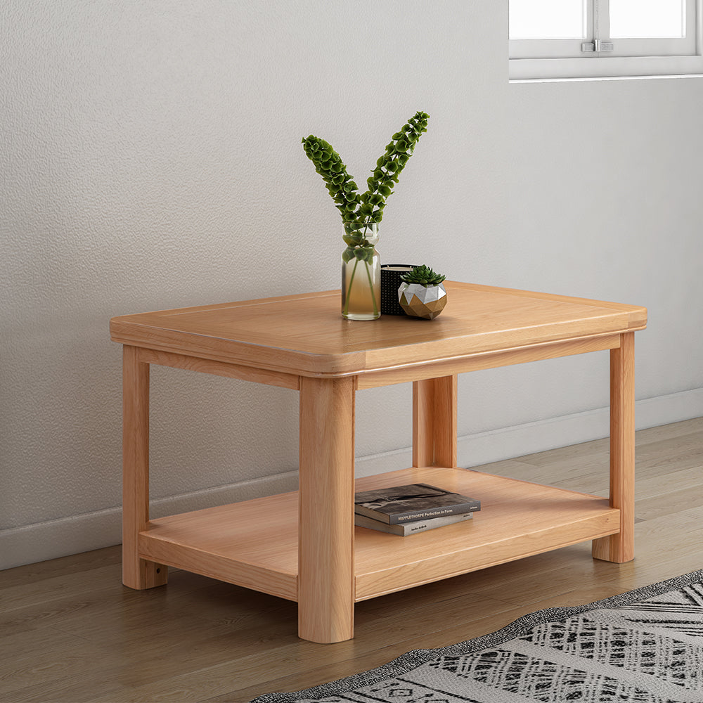 Wood coffee table with storage shelf in natural oak finish