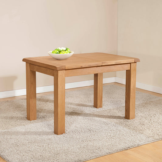 Solid wood extending dining table in natural oak finish