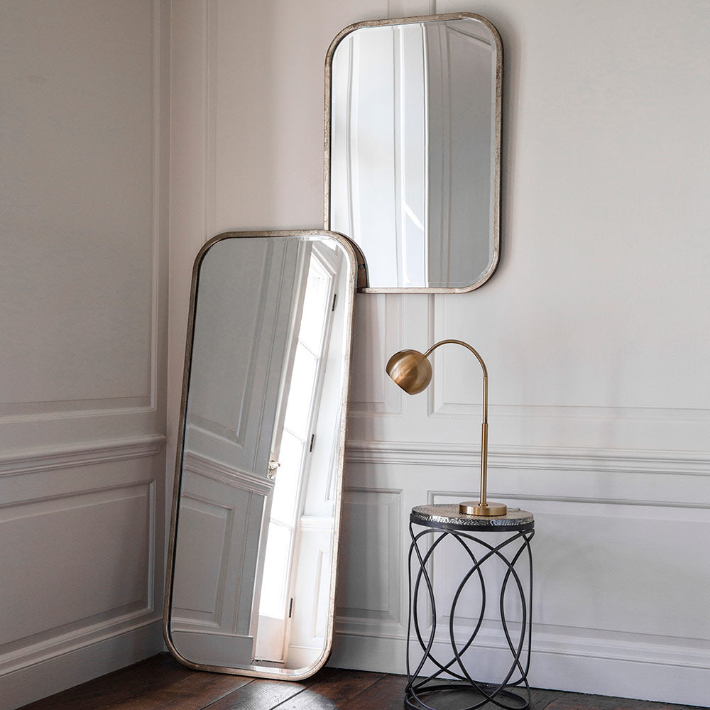 Curved mirror in champagne finish