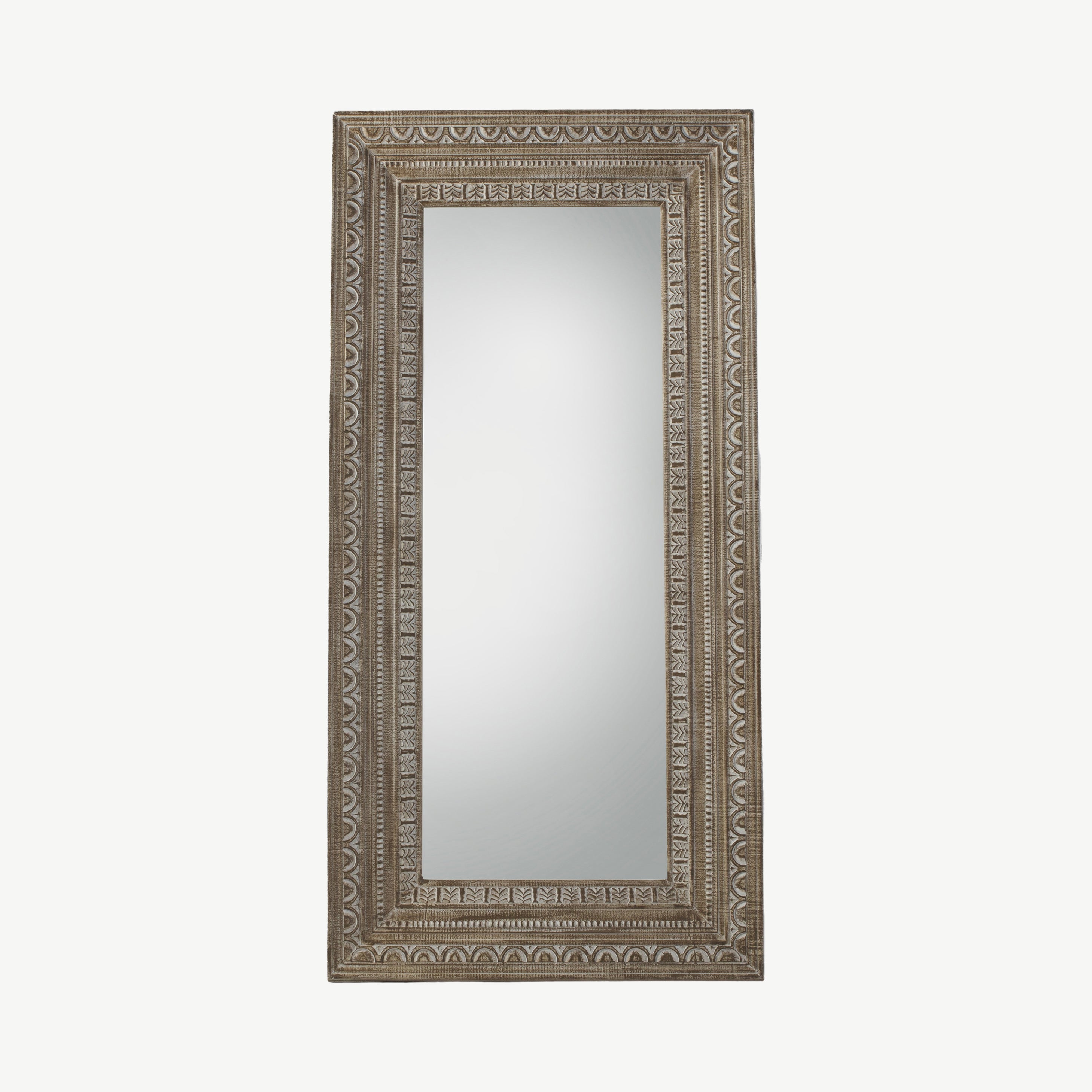 Large leaner mirror with intricate solid wood frame in washed finish