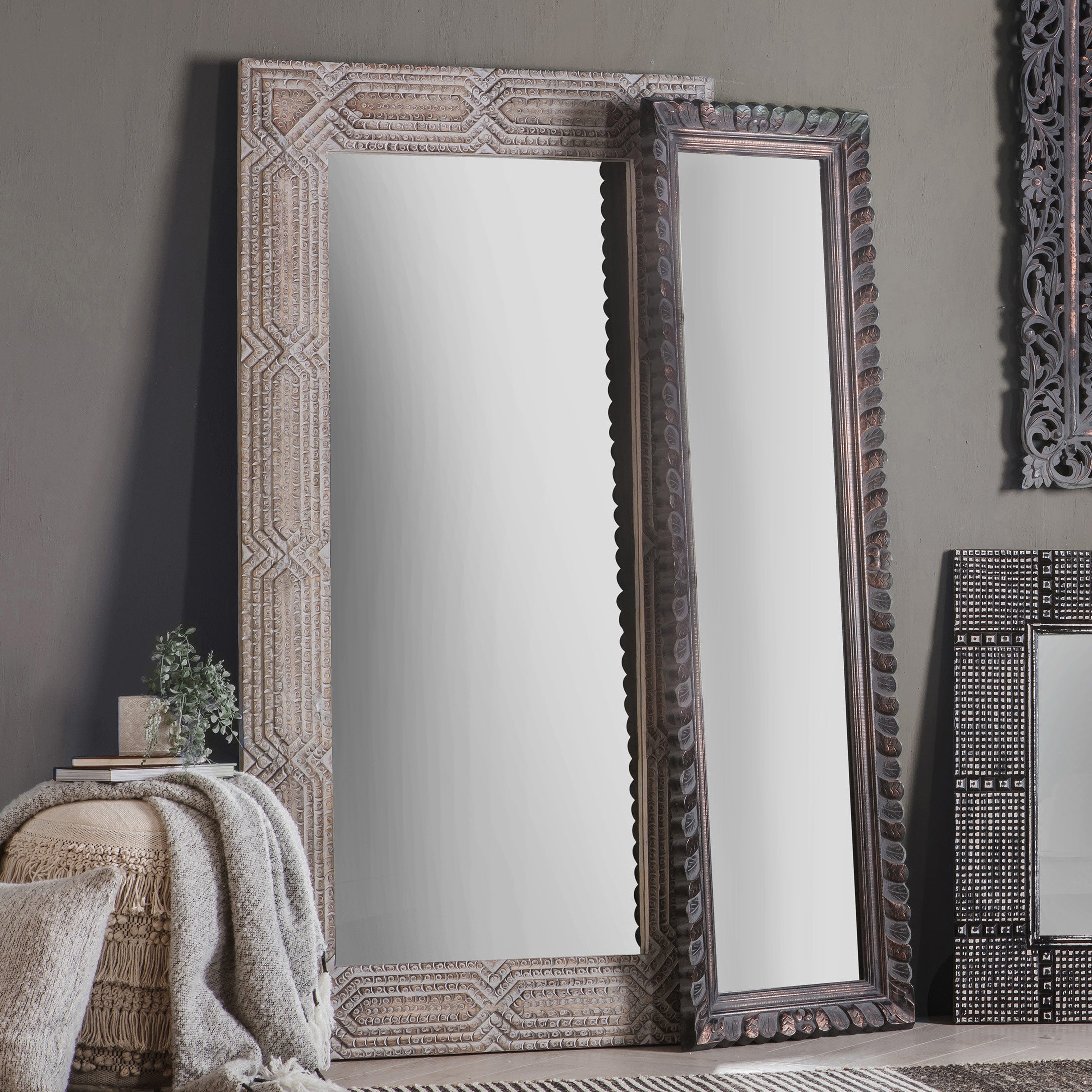 Large leaner mirror with intricate solid wood frame in washed finish