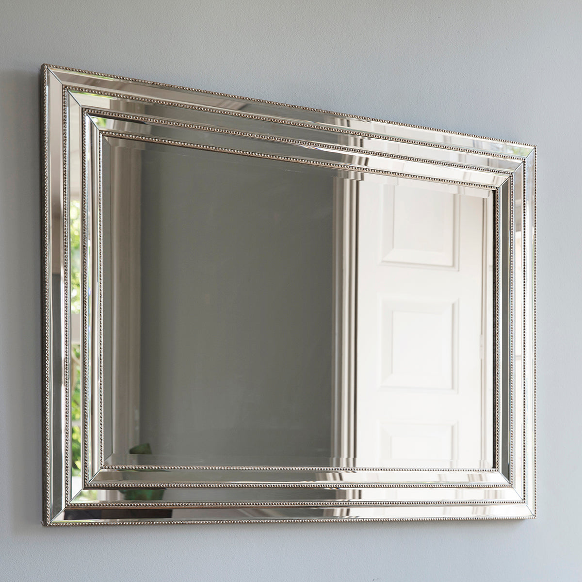 Bevelled silver mirror with beading